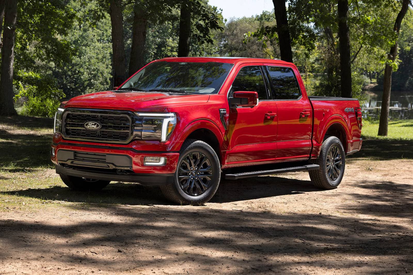 A red f-150 sitting parked.