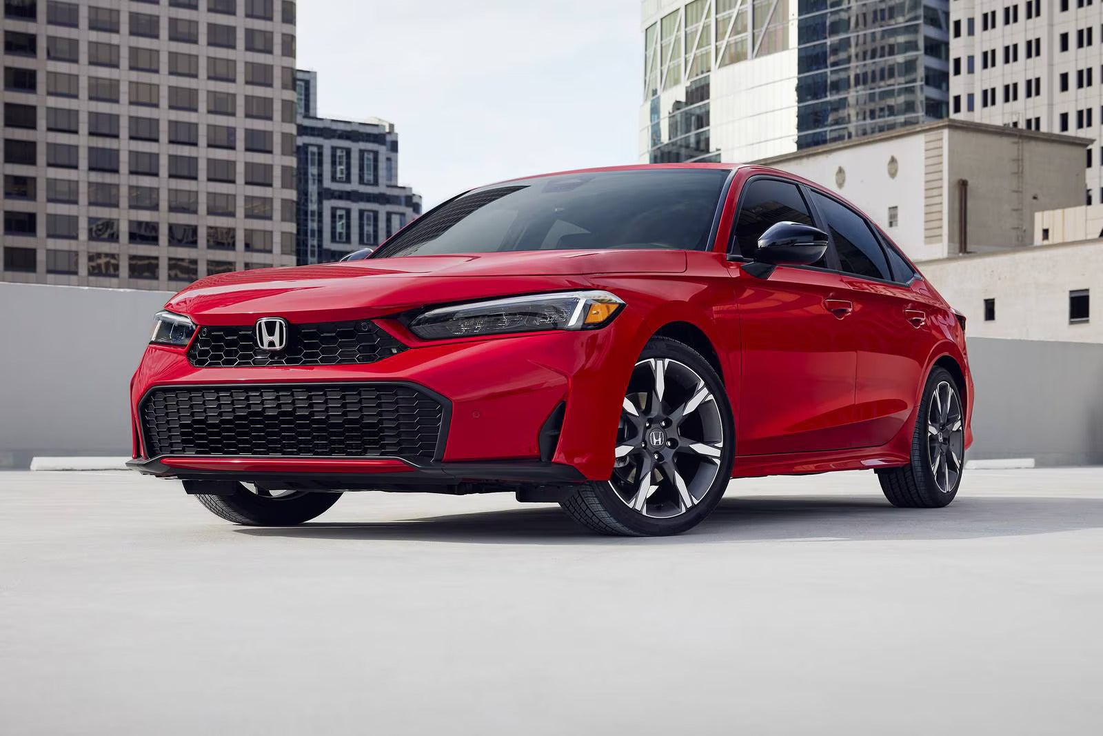 A red honda sitting parked.