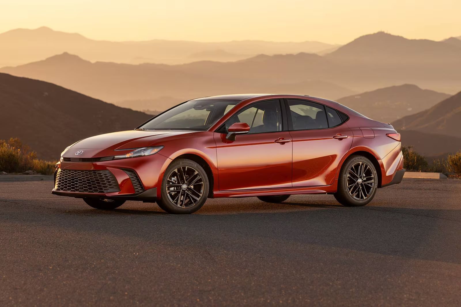 A red car sitting parked.