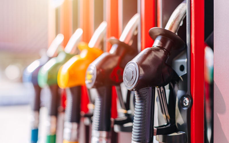 fuel pump hoses at a gas pump